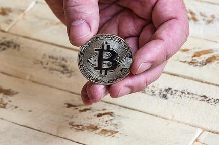 A powerful Bitcoin mining rig in action, symbolizing the high-stakes world of cryptocurrency extraction